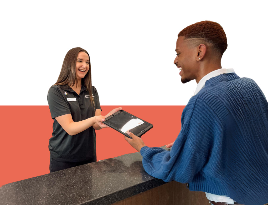 Student Staff and Student interact at Front Desk