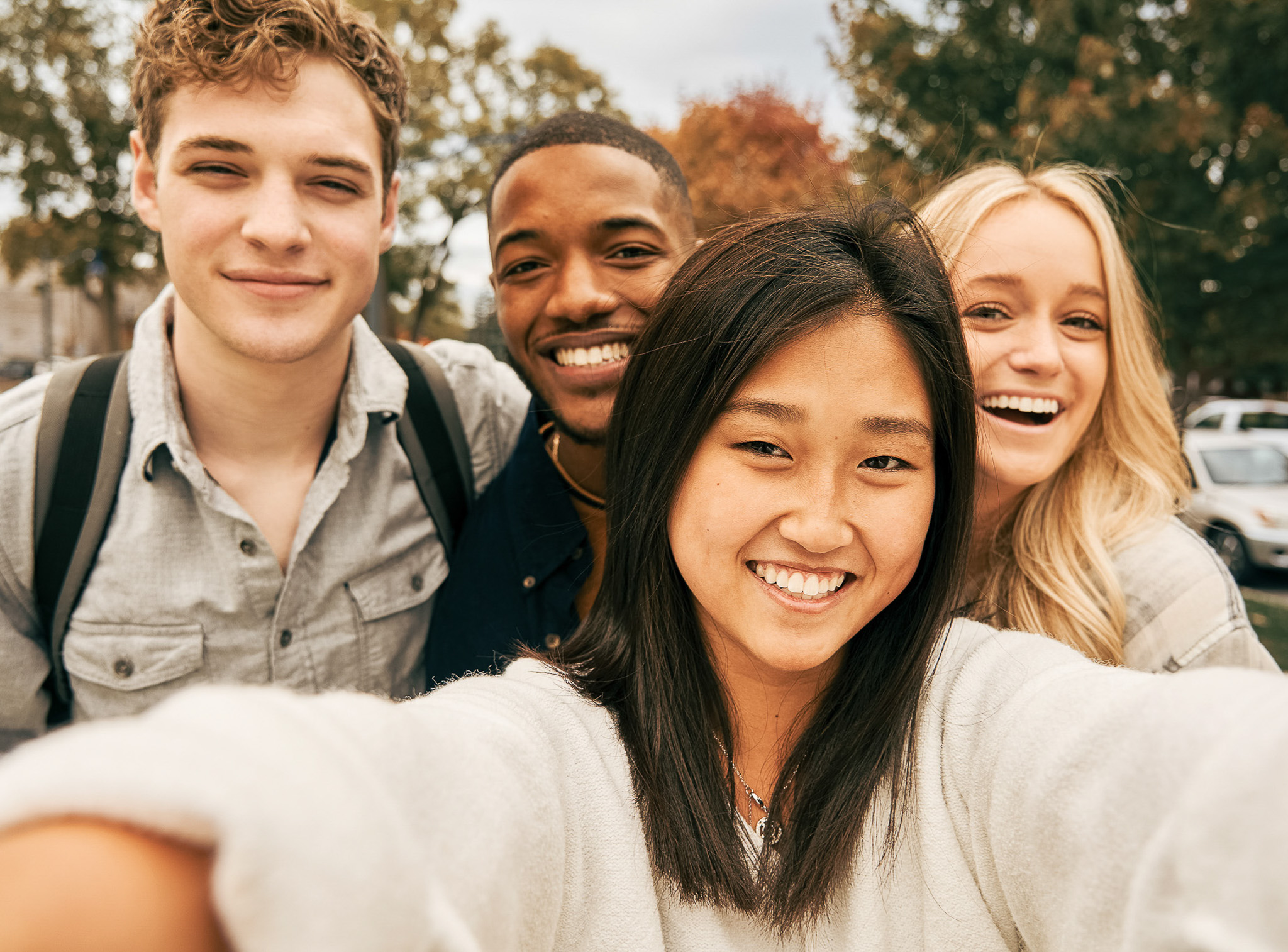 Selfie of a group of students on campus
