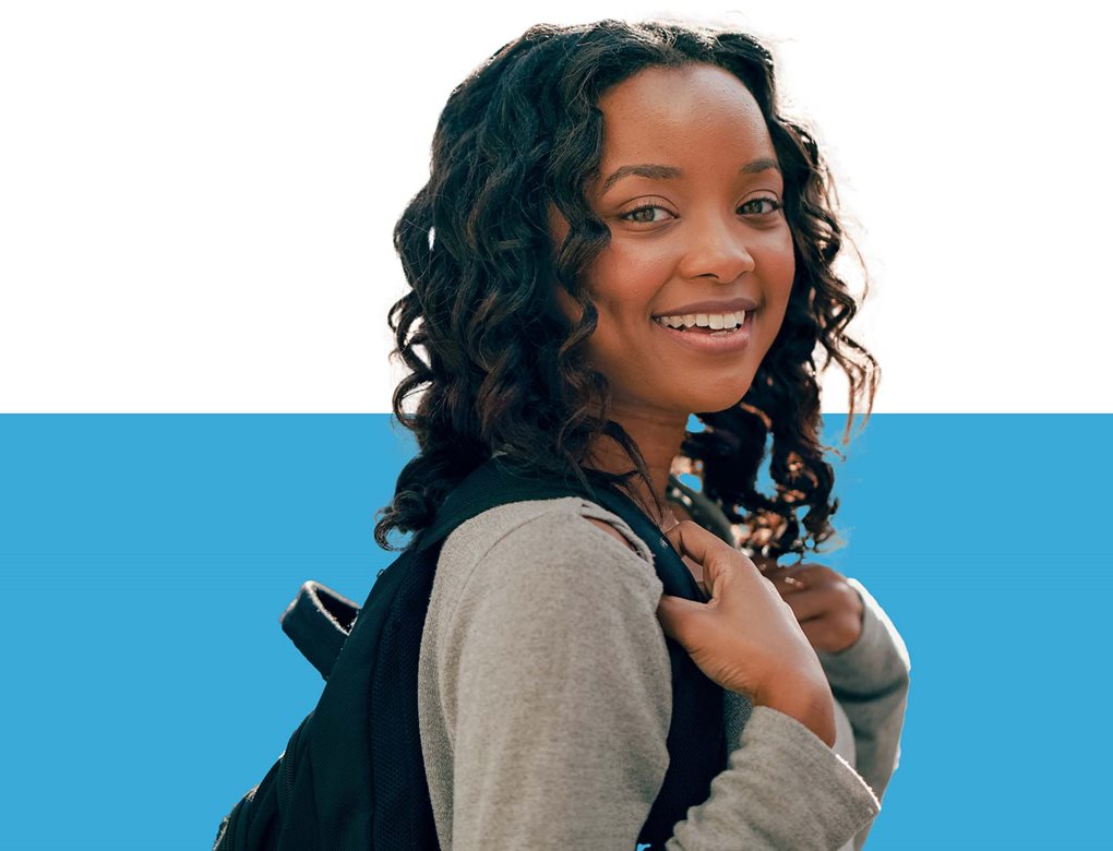 Student with backpack on campus